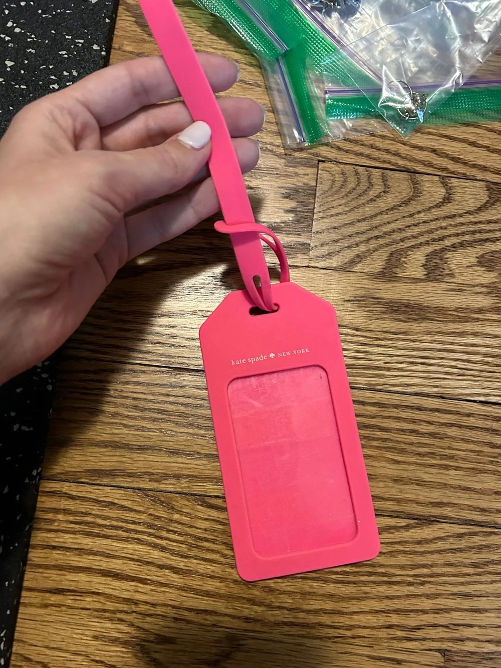 Kate Spade pink and orange luggage tag with flaw